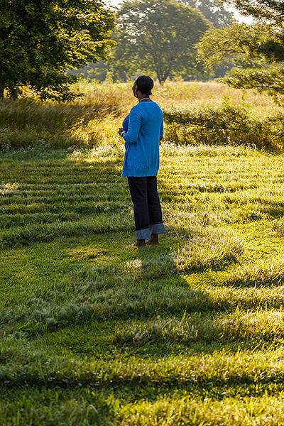 Student in the prayer labyrinth on the AMBS campus. Credit: Peter Ringenberg